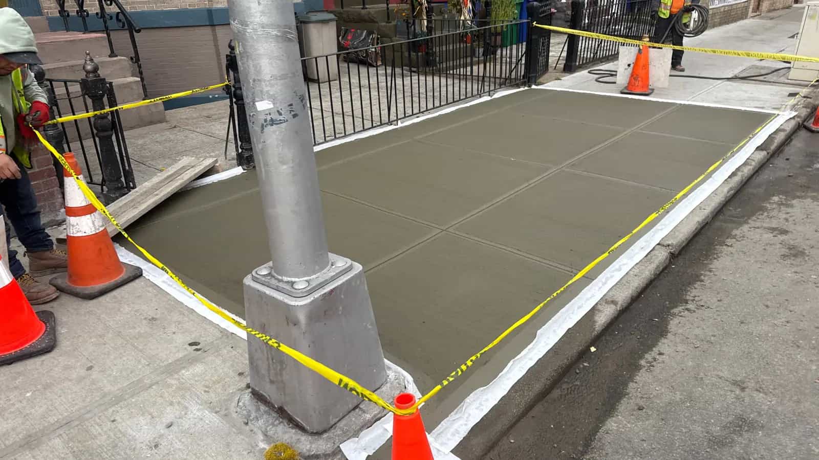Finished NYC sidewalk concrete slabs after compliant repair