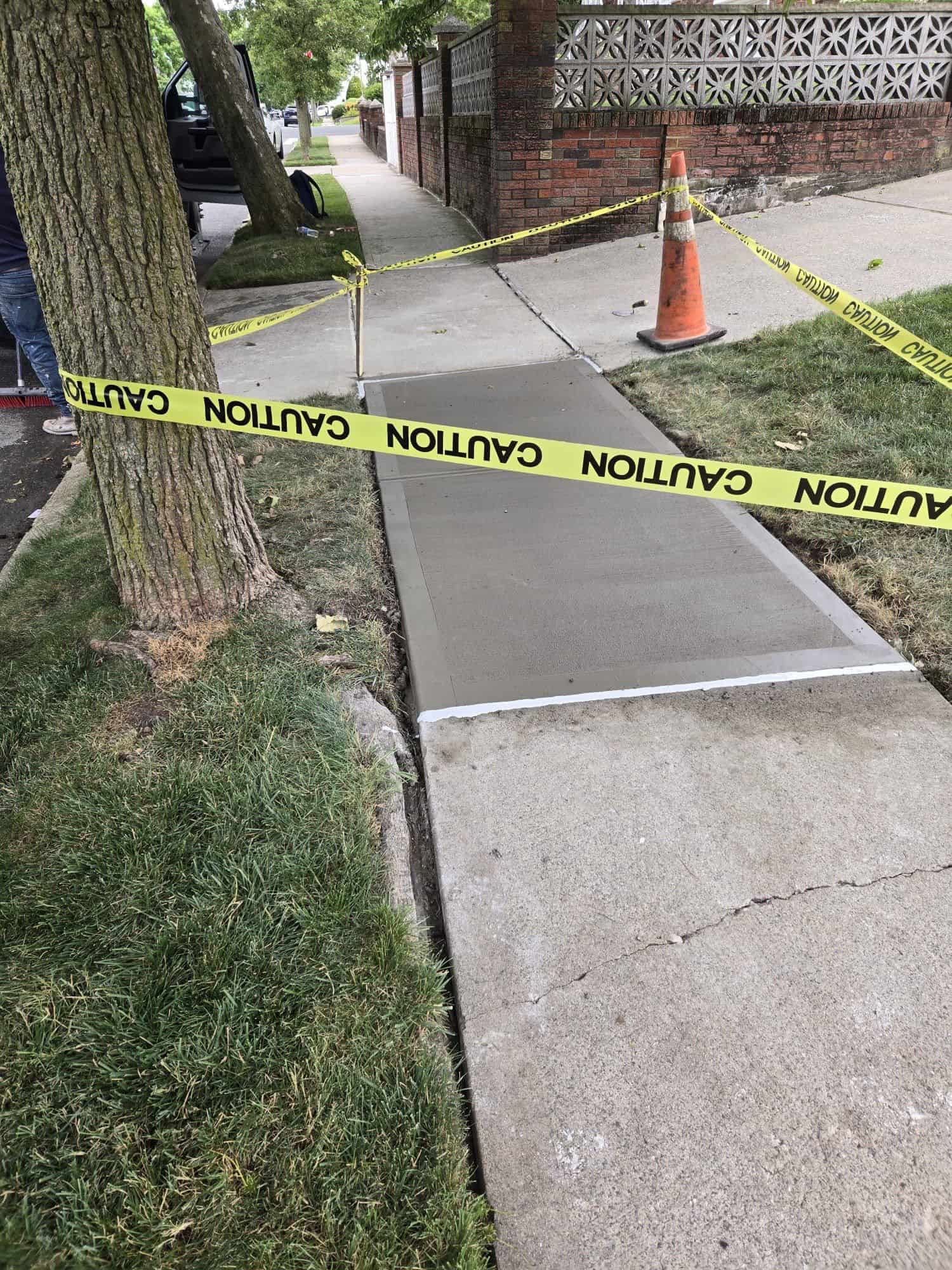 Tree root damaged sidewalk repair in progress